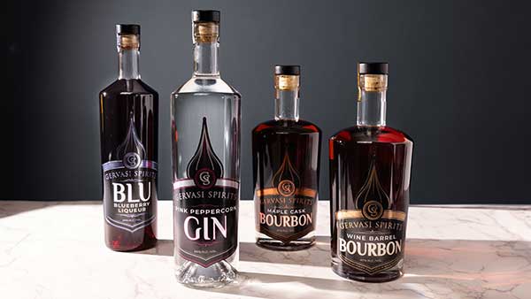 Award-winning Gervasi Spirits lineup featuring Blu Blueberry Liqueur, Pink Peppercorn Gin, Maple Cask Bourbon, and Wine Barrel Bourbon